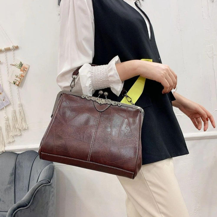 Vintage handbag with clasp closure